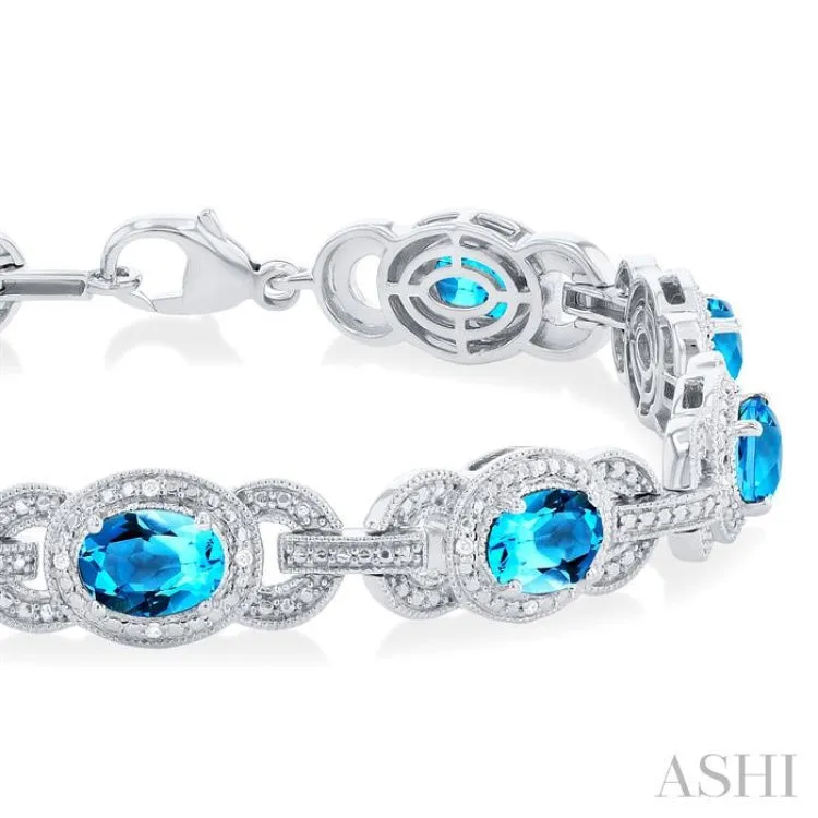 1/10 ctw Oval Cut 7x5MM Blue Topaz and Round Cut Diamond Semi Precious Bracelet in Sterling Silver