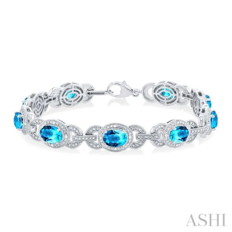 1/10 ctw Oval Cut 7x5MM Blue Topaz and Round Cut Diamond Semi Precious Bracelet in Sterling Silver