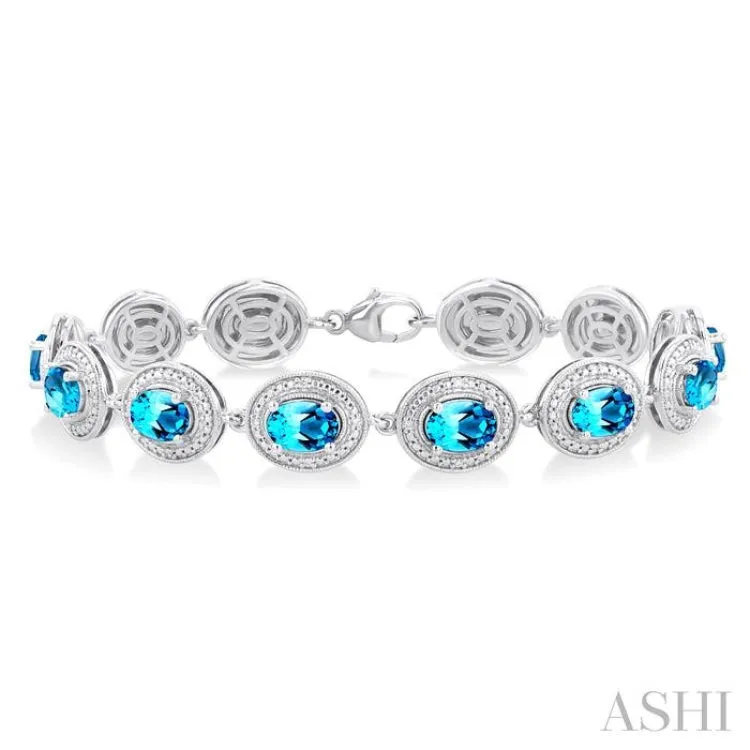 1/10 ctw Oval Shape 7X5 MM Blue Topaz and Round Cut Diamond Semi Precious Bracelet in Sterling Silver