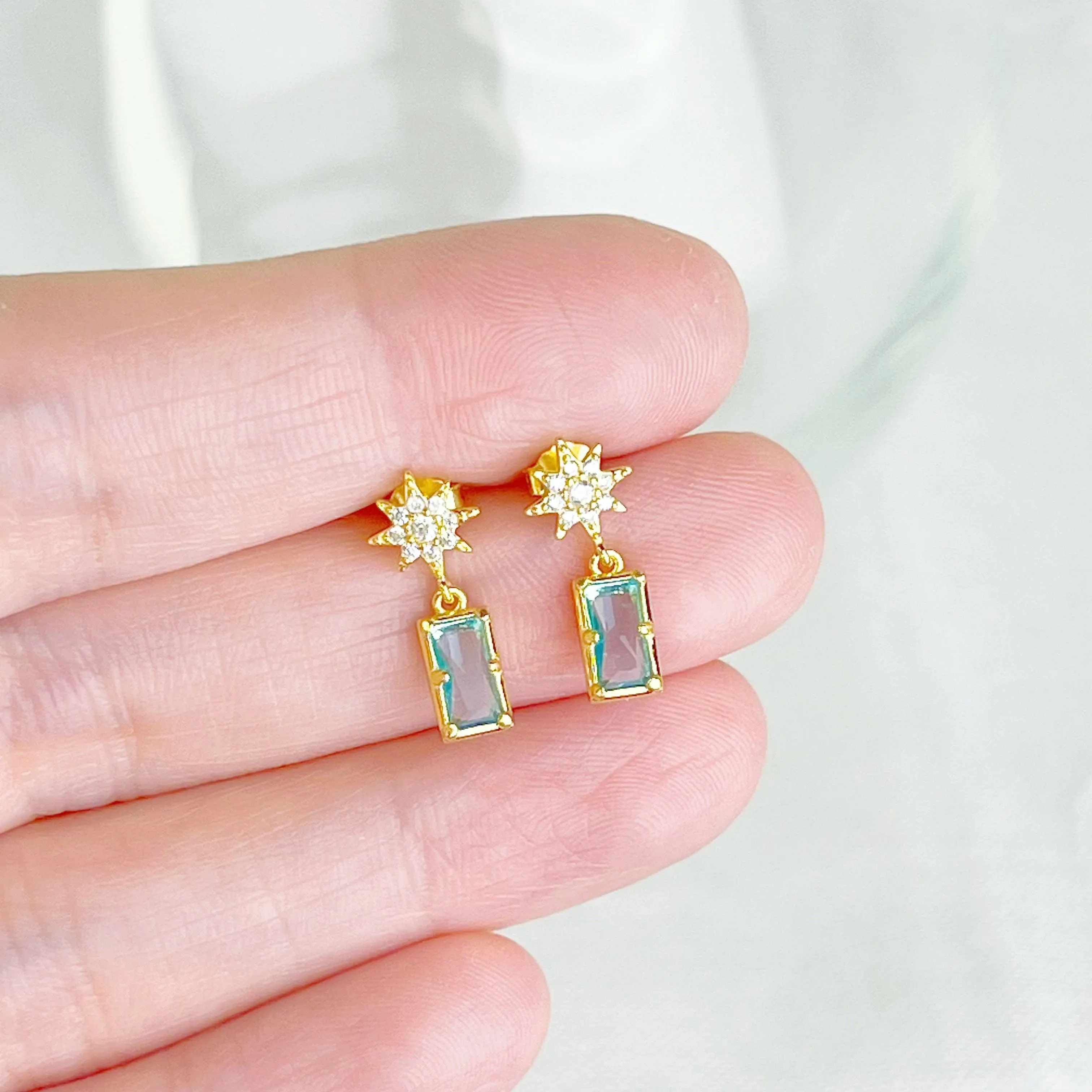 Ninaouity Gold Pole Star and Blue Square Crystal Earrings